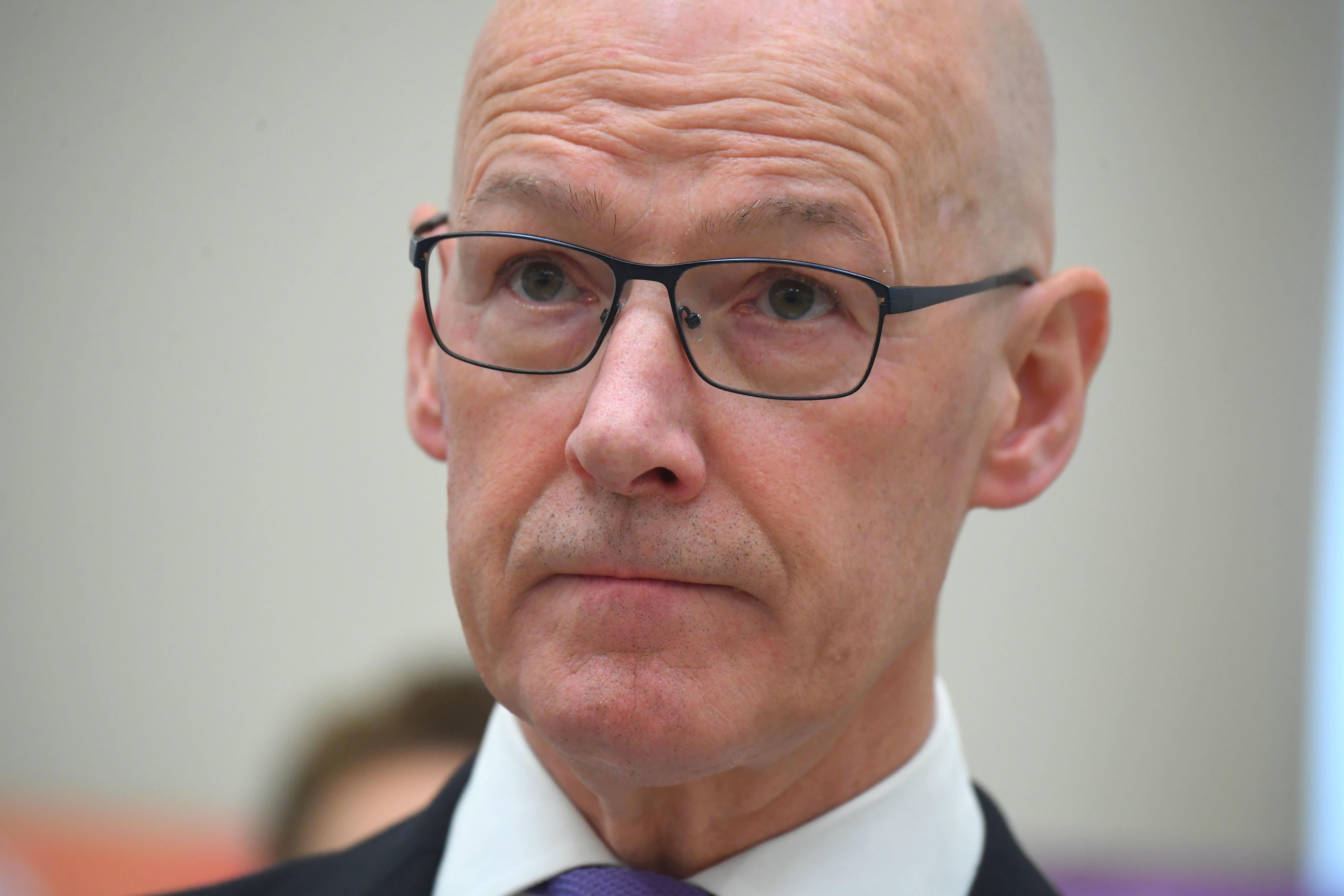 John Swinney condemned the ‘shoddy behaviour’ of Douglas Ross in putting himself forward for a Westminster seat because of the expected candidate’s ill health (Andy Buchanan/PA)