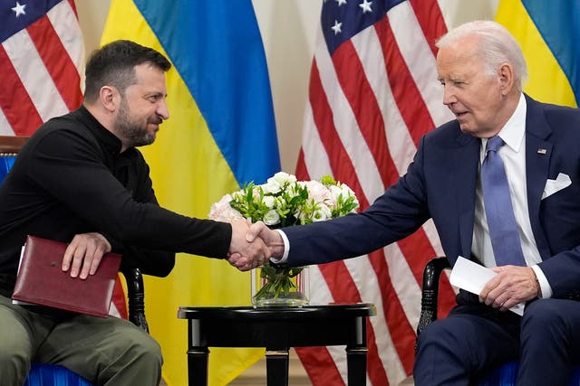 <p>U.S. President Joe Biden shakes hands with Ukrainian President Volodymyr Zelenskyy in Paris, Friday, June 7, 2024</p>