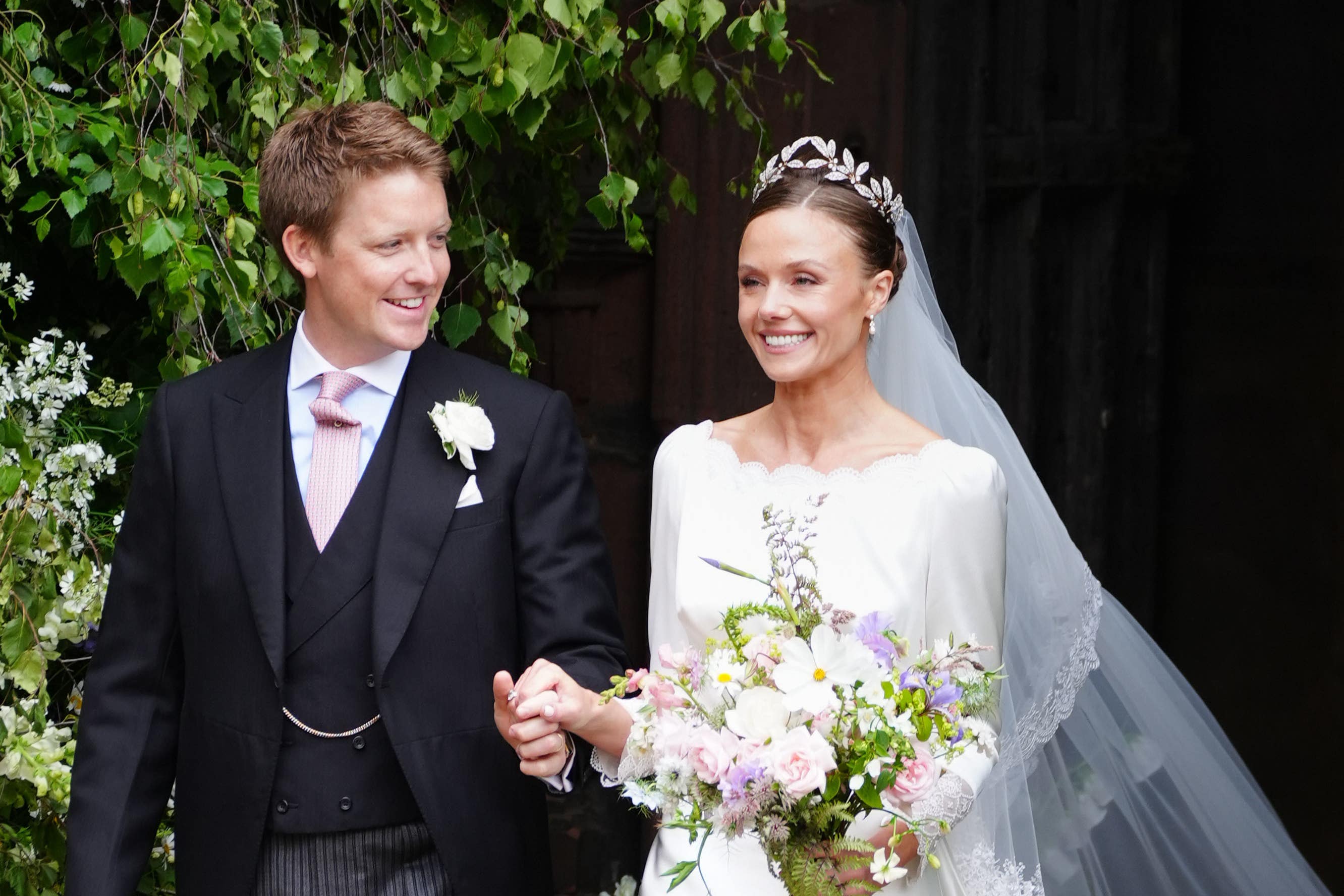 Olivia Henson and Hugh Grosvenor, the Duke of Westminster leave Chester Cathedral after their wedding (Peter Byrne/PA)