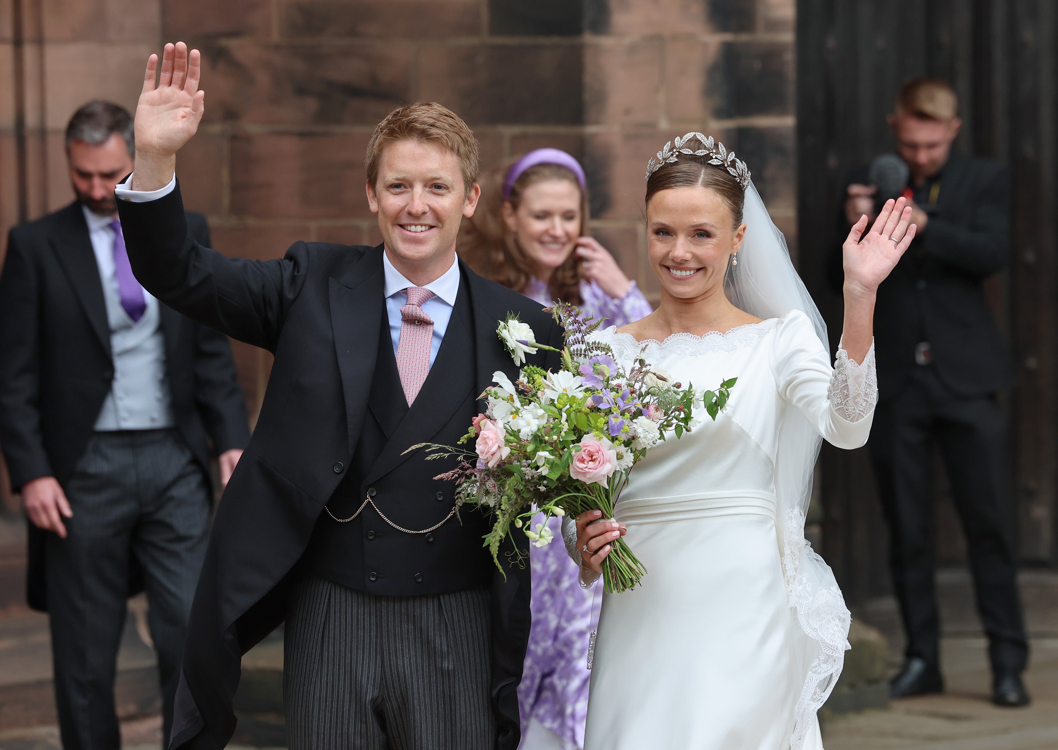 The couple then wave as waiting crowds give them three cheers