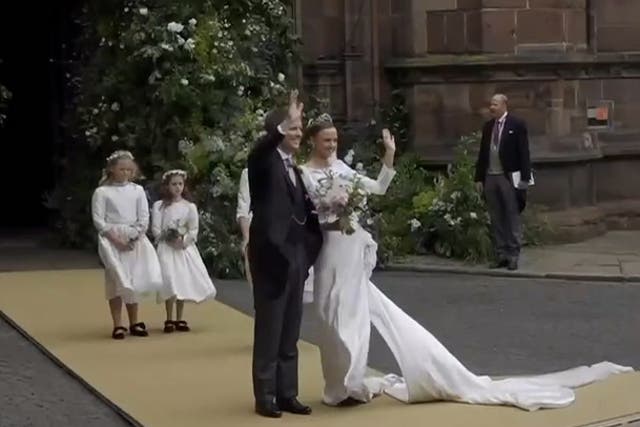 <p>Olivia Henson’s bridesmaid comes to rescue as bride’s dress gets caught in gust of wind.</p>