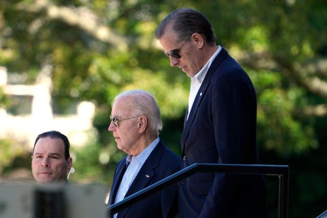 <p>President Joe Biden, and his son Hunter Biden, right, leave St Edmond Catholic Church in Rehoboth Beach, Delaware, on 1 June 2024</p>