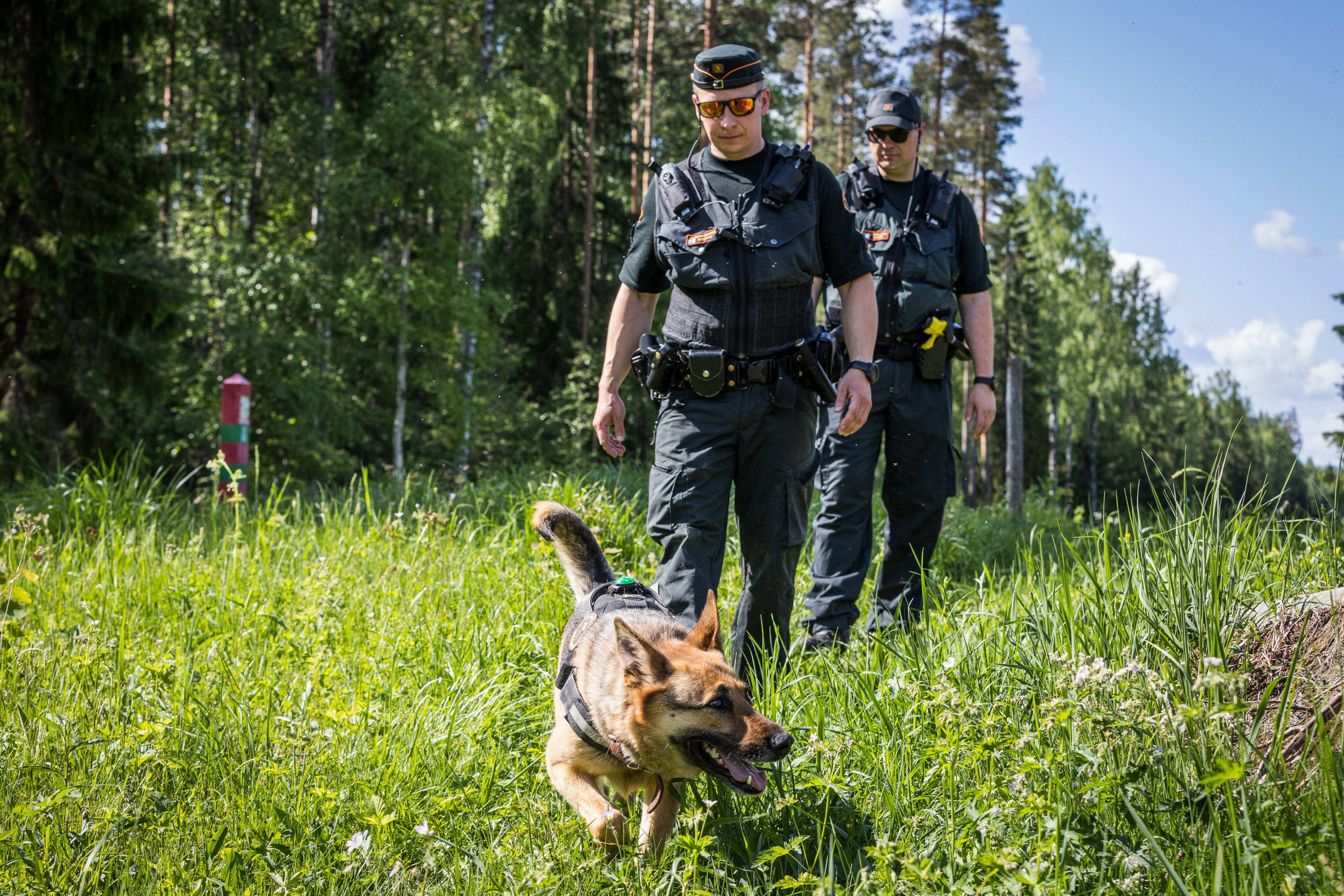 Finnish guards with dog Nita patrol in Joensuu near the border with Russia