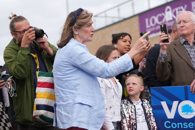 Jane Lees-Millais heckles Prime Minister Rishi Sunak during his visit to Melksham Town Football Club (PA)