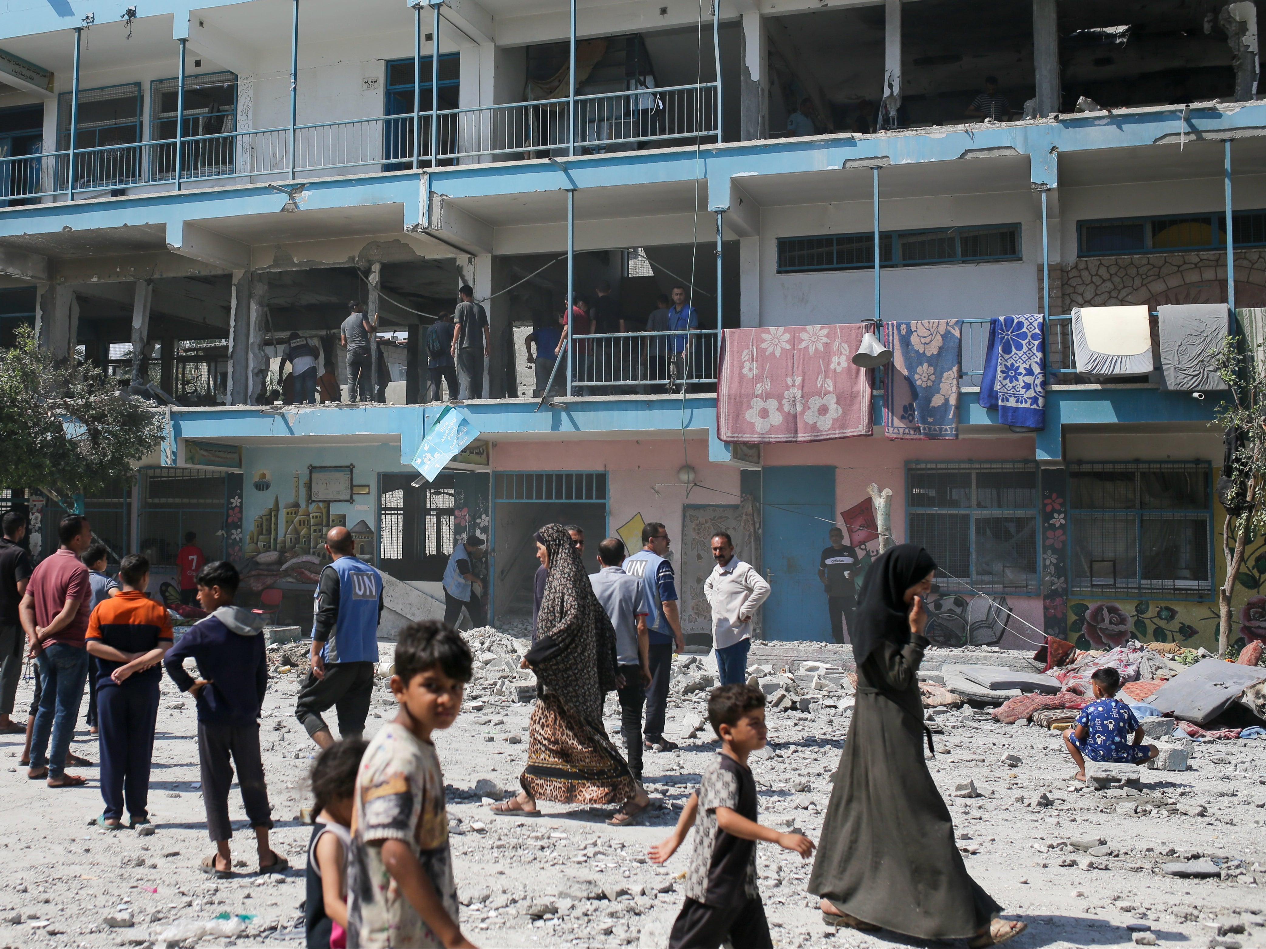 The aftermath of an Israeli strike on a UN-run school that killed dozens of people in the Nuseirat refugee camp