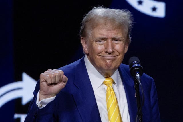 <p>Republican presidential candidate and former U.S. President Donald Trump gestures during a Turning Point USA event at the Dream City Church in Phoenix, Arizona</p>