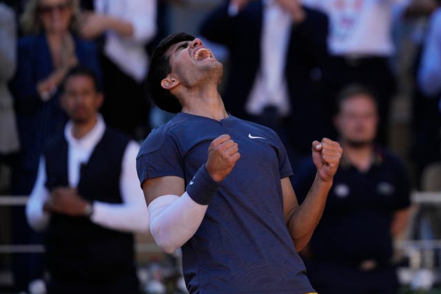 Carlos Alcaraz celebrates beating Jannik Sinner (Thibault Camus/AP)