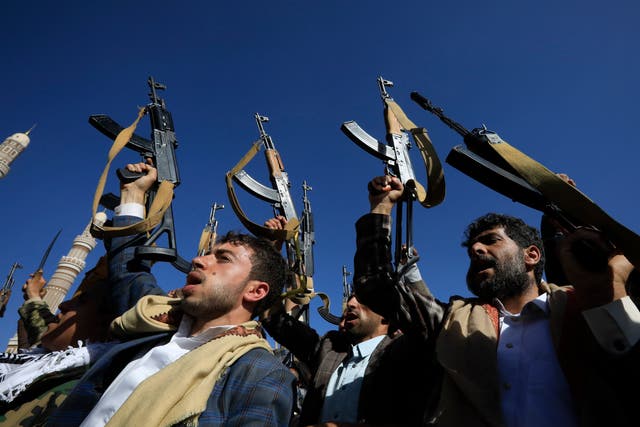 <p>Houthi supporters chant slogans while holding up weapons during a protest against the US and Israel, and in solidarity with the Palestinian people, in Sana'a, Yemen</p>