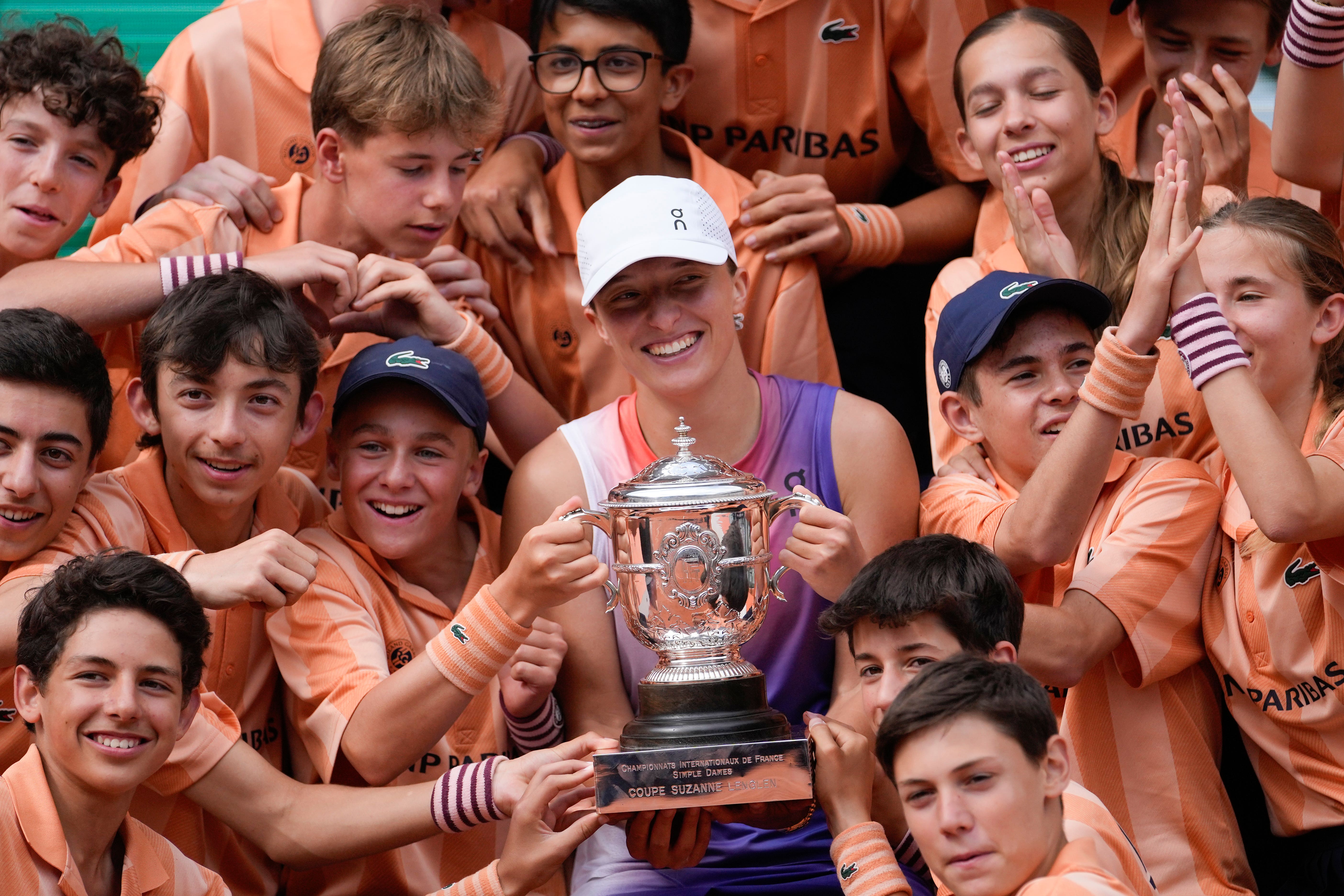 French Open champion Iga Swiatek with the ball kids