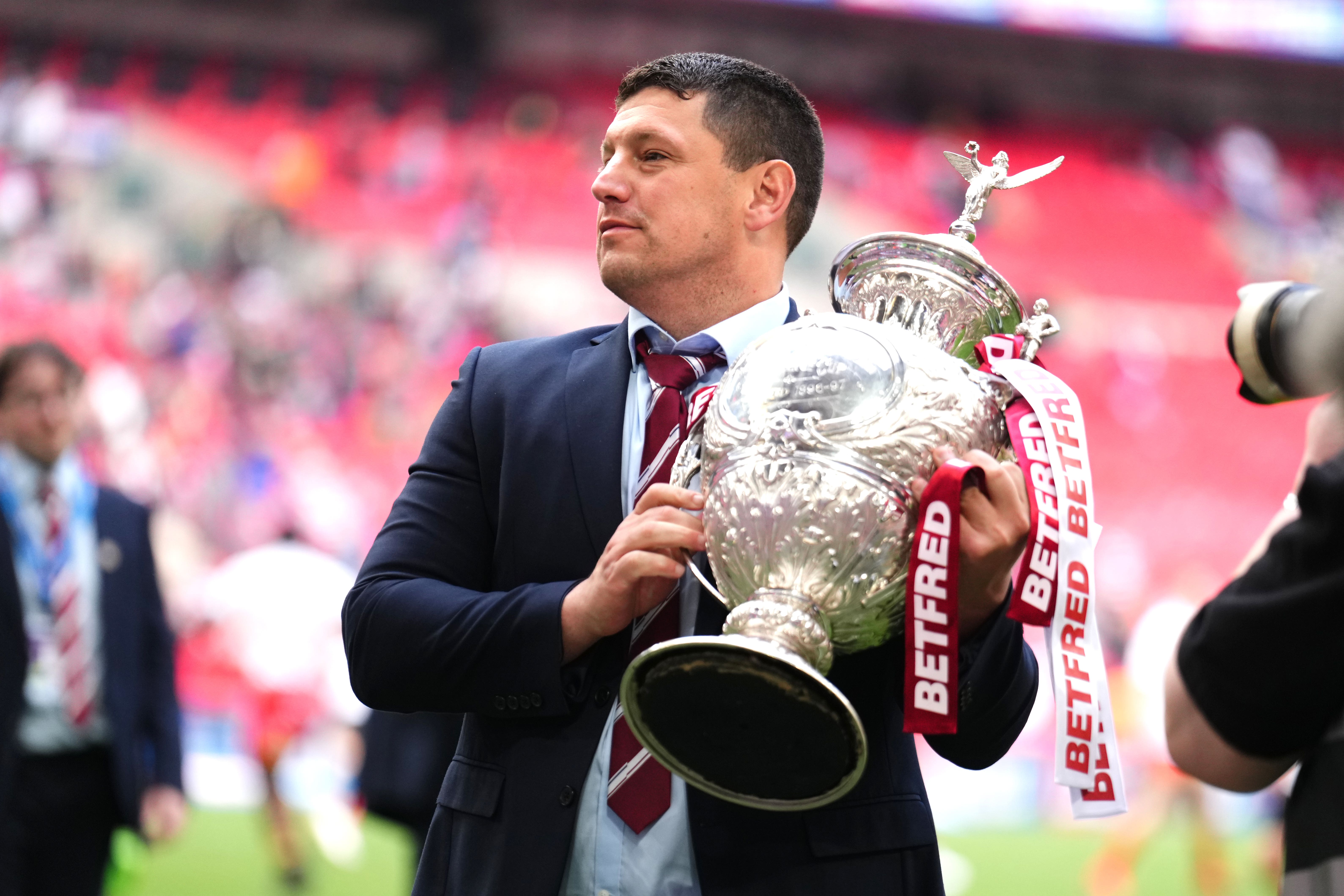 Wigan head coach Matt Peet celebrates with the Challenge Cup trophy (John Walton/PA)