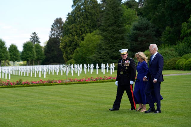 <p>U.S. President Joe Biden and First Lady Jill Biden walk with Major General Robert B. Sofge Jr. as they attend a wreath laying ceremony at the Aisne-Marne American World War One Cemetery in Belleau, France, Sunday, June 9, 2024</p>