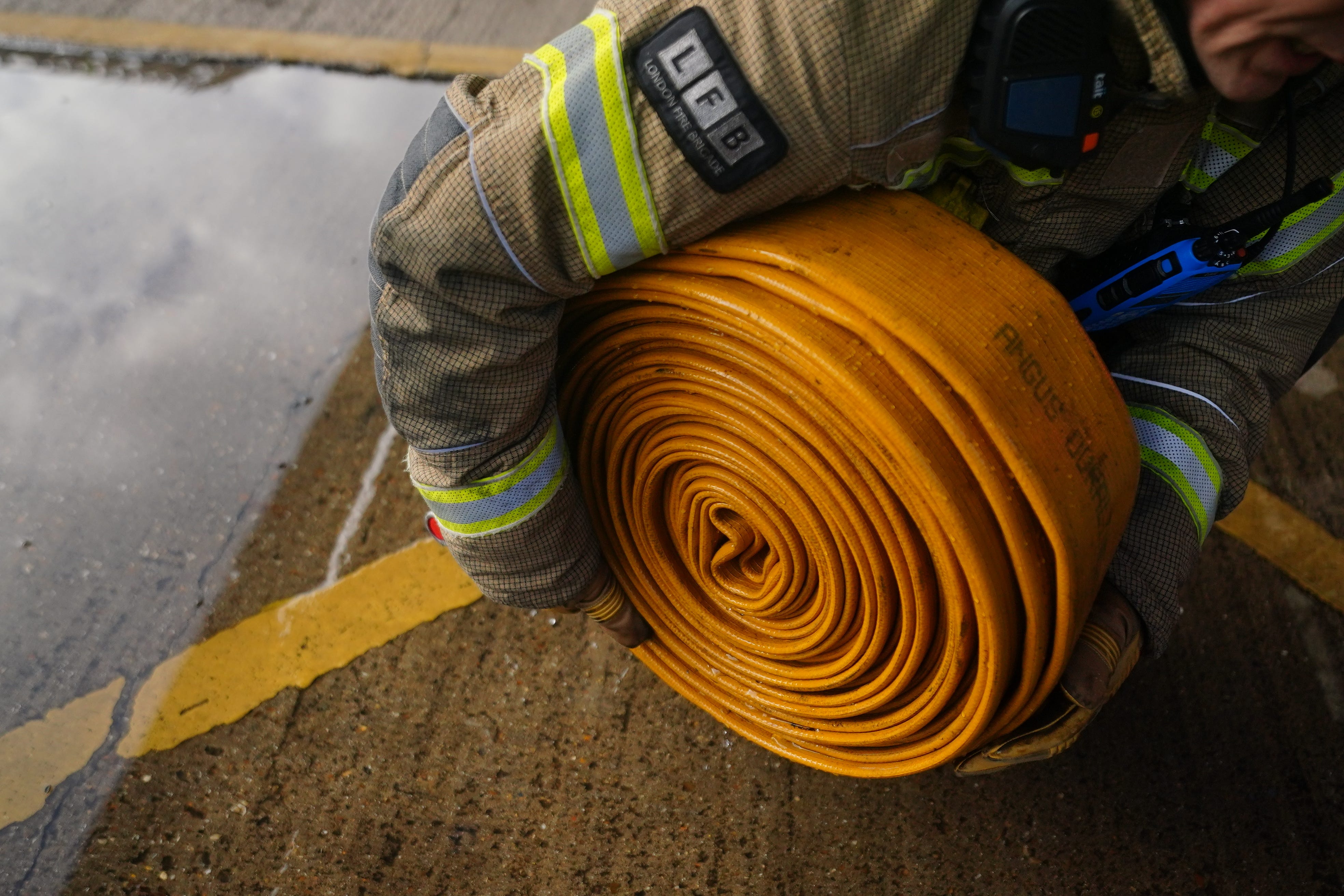 Firefighter officers run through a practice drill (VIctoria Jones/PA)