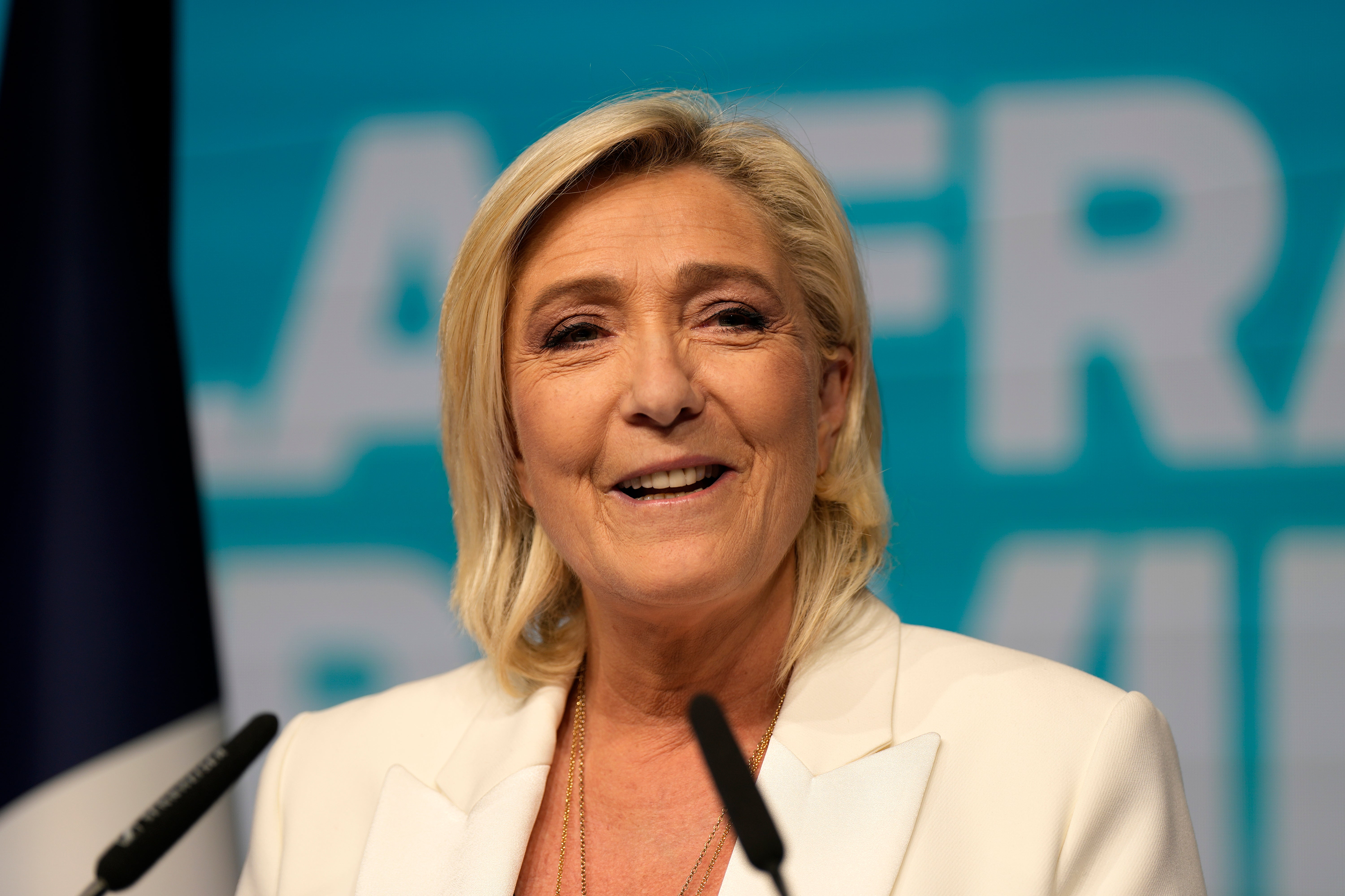 French far-right leader Marine Le Pen delivers her speech at the party election night headquarters on Sunday