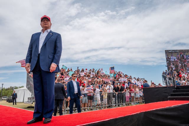 <p>Donald Trump greets voters upon arriving at his rally in Las Vegas on 9 June 2024</p>