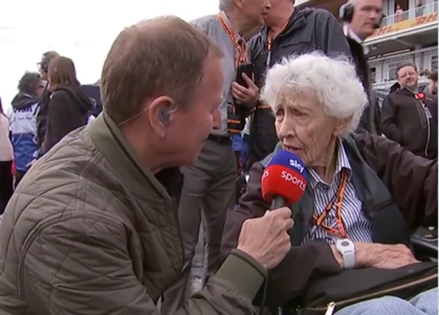 <p>Martin Brundle speaks to Mary McGee on the grid at the Canadian Grand Prix on Sunday</p>