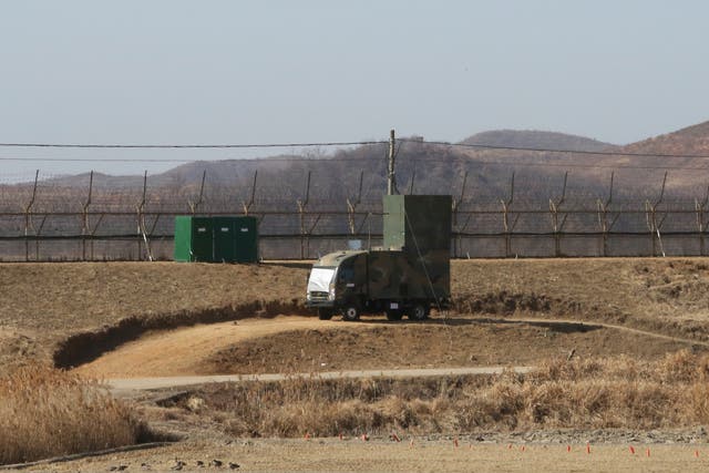 <p>A South Korean military vehicle with loudspeakers is seen in front of the barbed-wire fence in Paju</p>