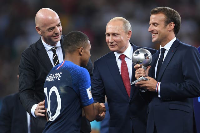 <p>Kylian Mbappe of France shakes hands with Vladimir Putin, President of the Russian Federation</p>