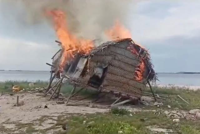 <p>Smoke rises as a house is demolished in Tun Sakaran Marine Park, Sabah, Malaysia, in this screen grab obtained from a social media video, released on June 4, 2024</p>
