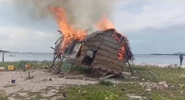 <p>Smoke rises as a house is demolished in Tun Sakaran Marine Park, Sabah, Malaysia, in this screen grab obtained from a social media video, released on June 4, 2024</p>