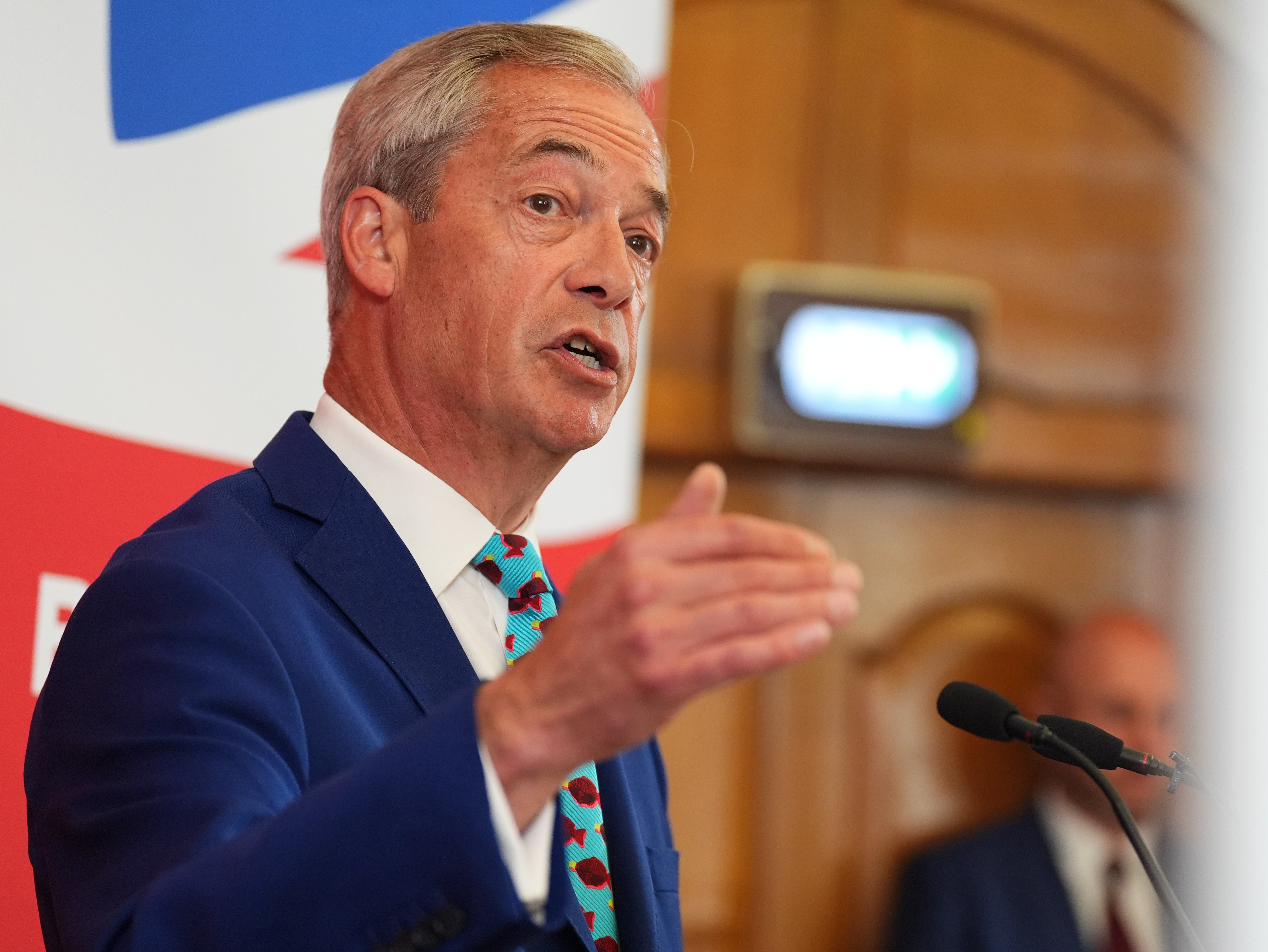 Leader of Reform UK Nigel Farage at an announcement of the party's economic policy during a press conference at Church House in London
