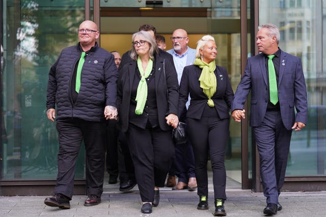 <p>Harry Dunn’s father Tim Dunn (left) and mother Charlotte Charles (second from right) paid emotional tributes to their son at his inquest on Monday (James Manning/PA)</p>