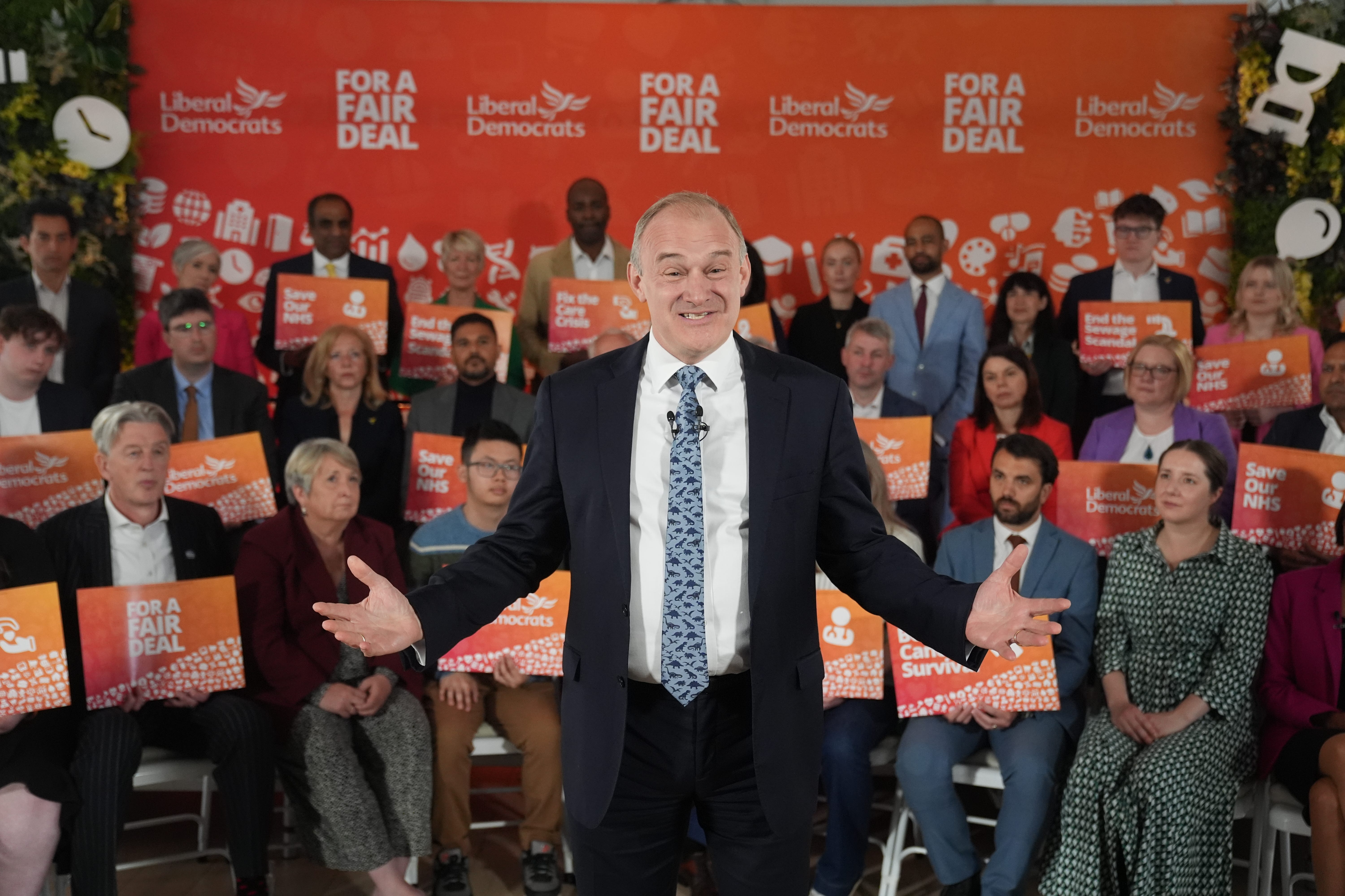 Sir Ed Davey backed by Lib Dem supporters at the party’s election manifesto launch (Lucy North/PA)