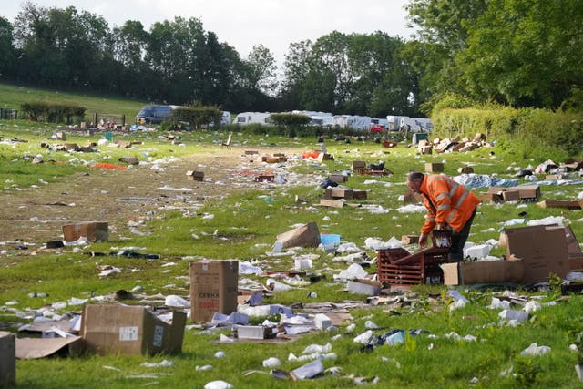 <p>Rubbish being cleared in a field at the end of the Appleby Horse Fair, the annual gathering of the travelling community in Appleby</p>