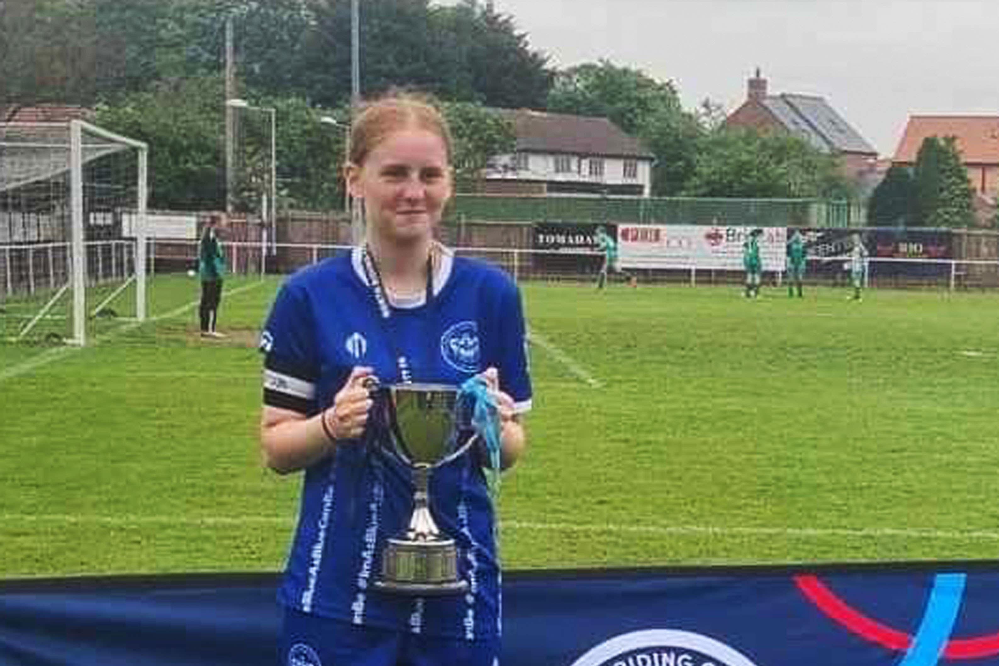 Lily Lucas, captain of Thornaby under 15s, lifting a trophy for the club (Family handout/PA)