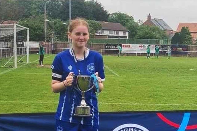 Lily Lucas, captain of Thornaby under 15s, lifting a trophy for the club (Family handout/PA)