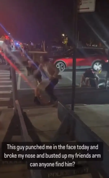 The woman is seen in the video falling to the ground after she is punched