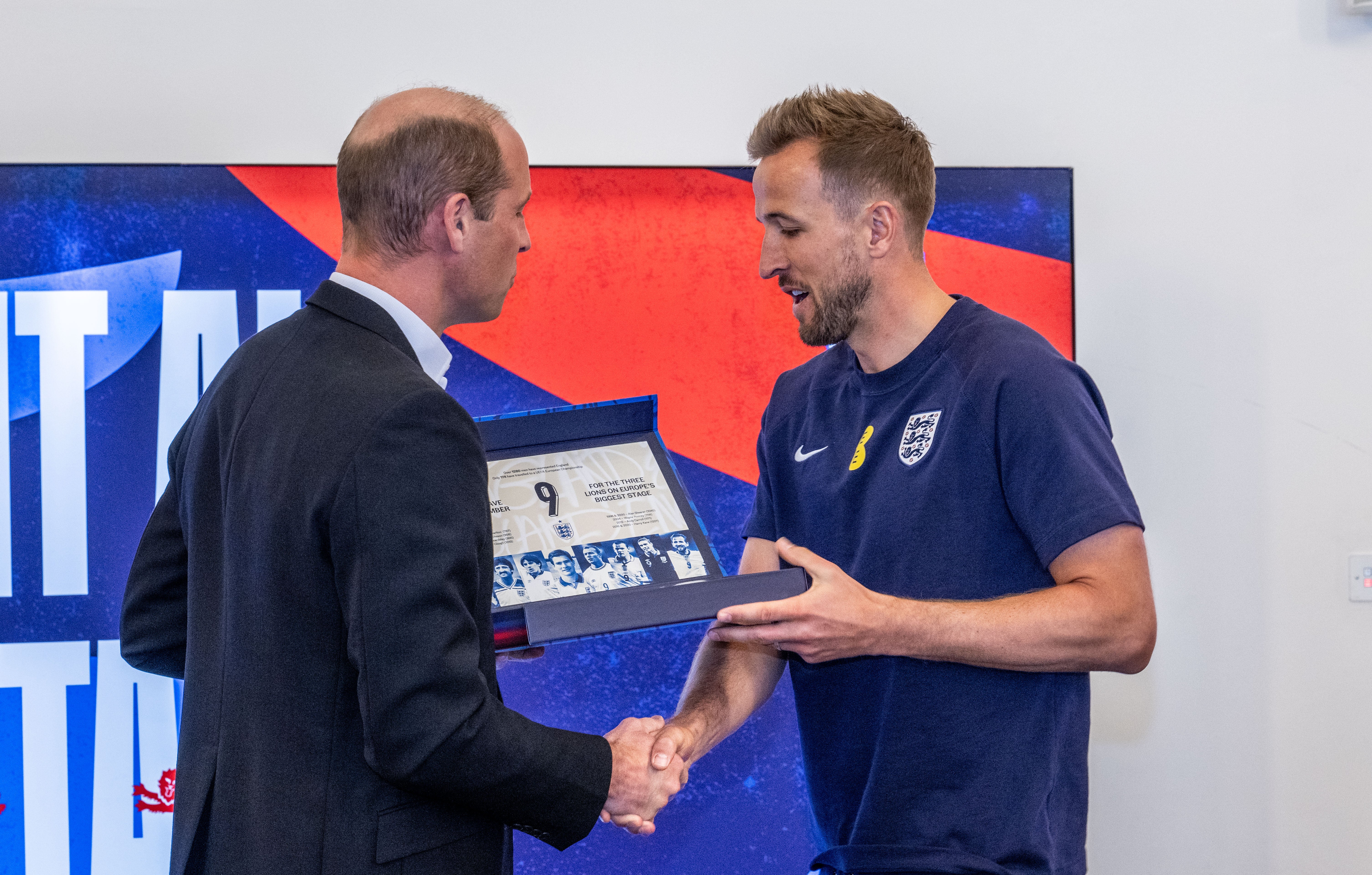 The Prince of Wales makes a presentation to England captain Harry Kane