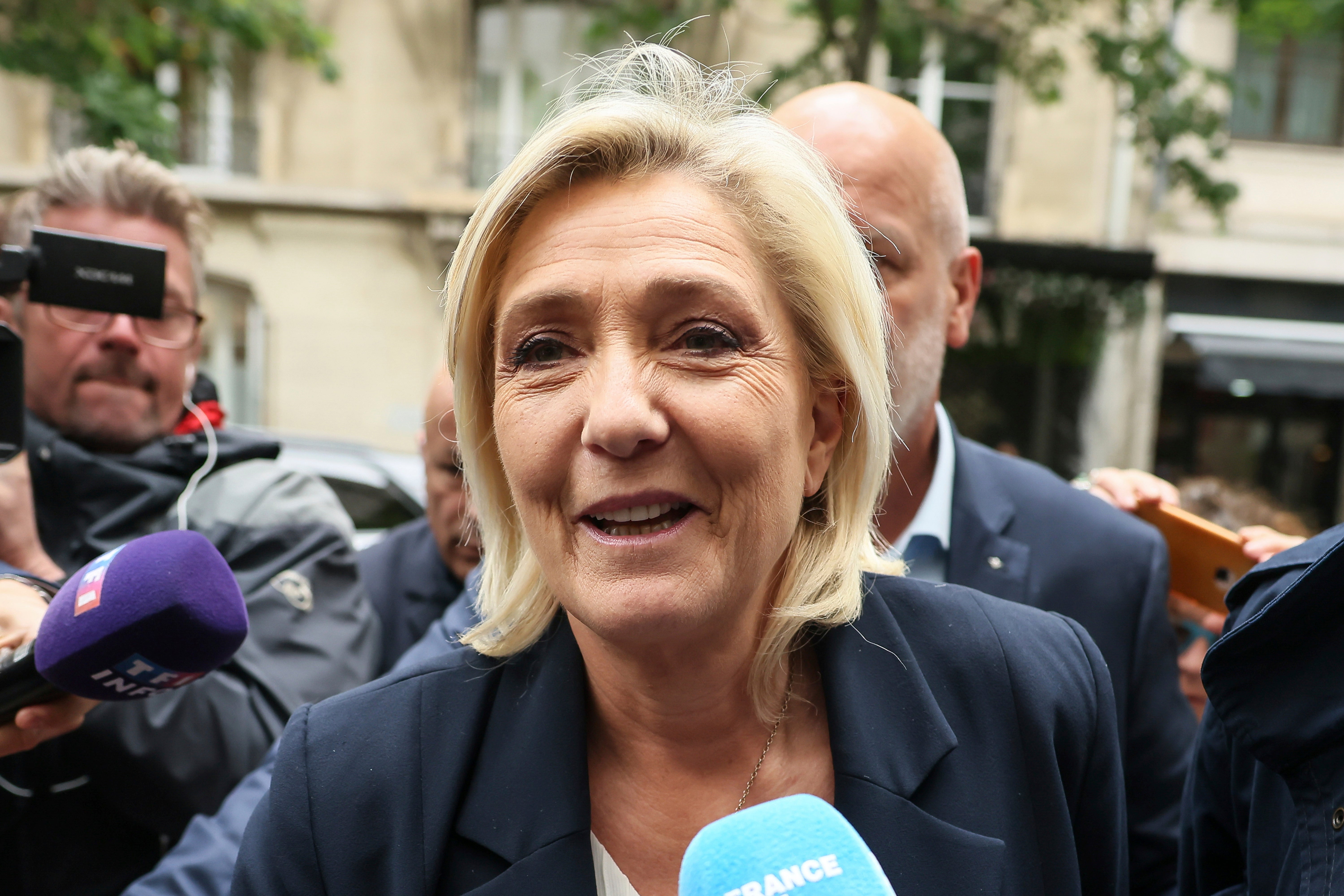 Mr Macron said the policies of far-right National Rally and extreme leftwing La France Insoumise divided and isolated people, which would lead to a “civil war” between different communities. Pictured: National Rally’s Marine Le Pen