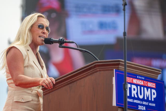 <p>Rep Marjorie Taylor-Greene speaks to Trump supporters at a Las Vegas rally</p>