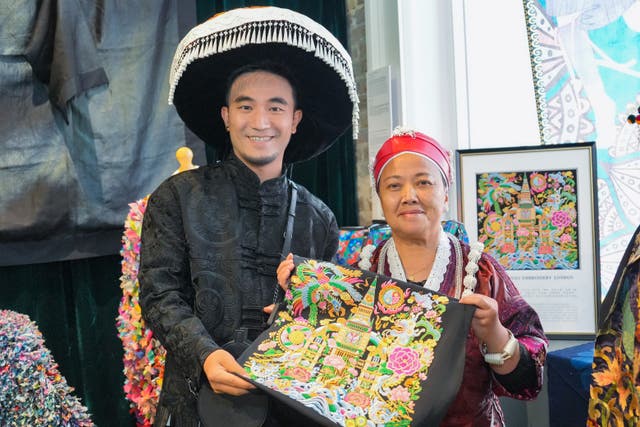 <p>Miao ethnic designer Yang Chunlin and his mother Yang Shiying showcase a representation of the Big Ben at an exhibition during the 10th London Craft Week in May</p>