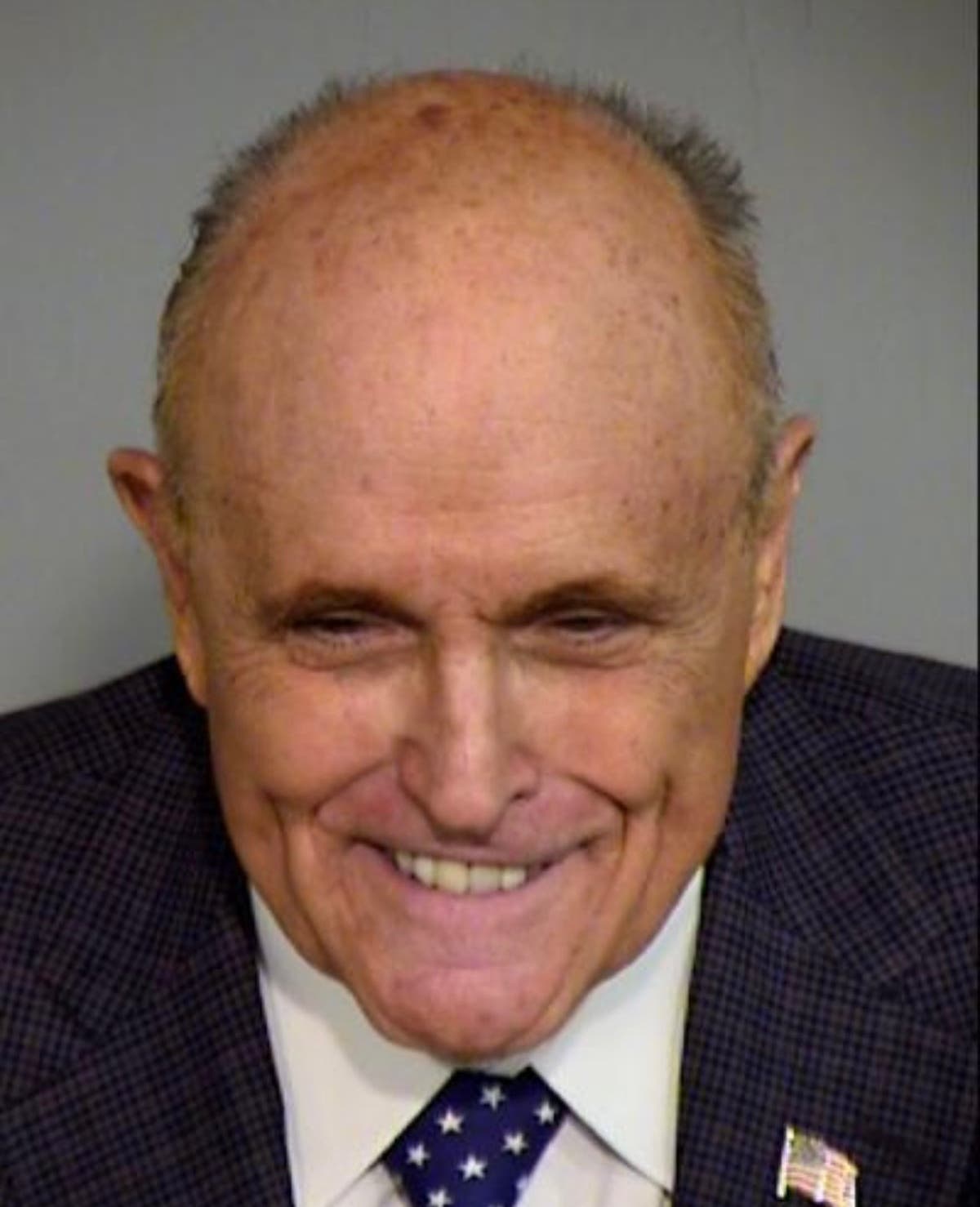 Rudy Giuliani poses for mugshot weeks after pleading not guilty in Arizona fake electors case