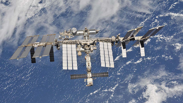 <p>International Space Station orbiting above Earth</p>