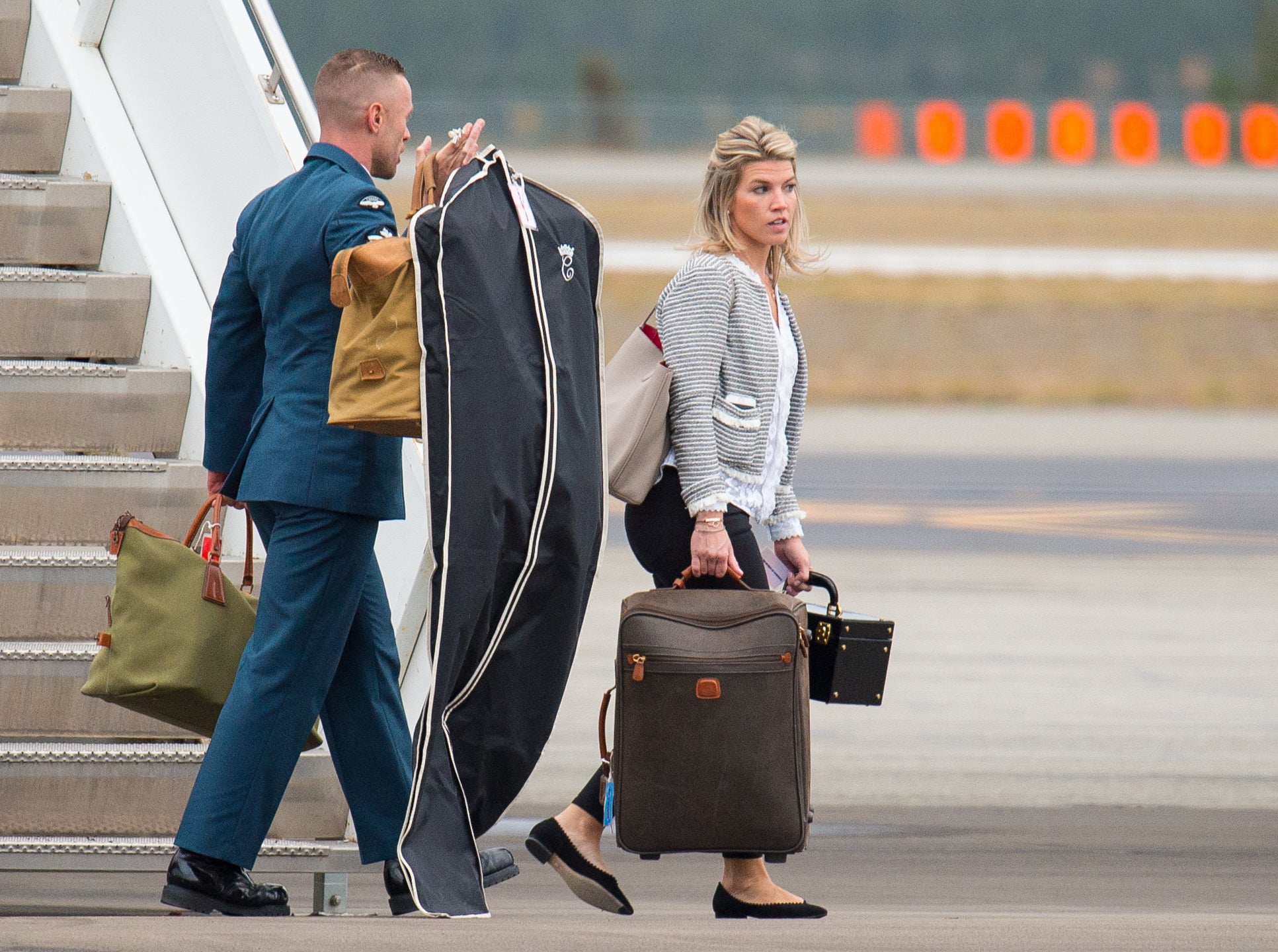 Natasha carrying the Princess’ bags from a plan in Canada during her 2016 royal tour