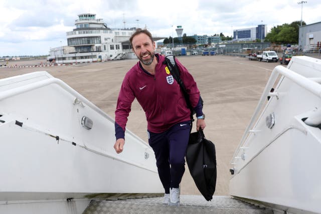 <p>Gareth Southgate boards England’s plane to Germany at Birmingham Airport</p>
