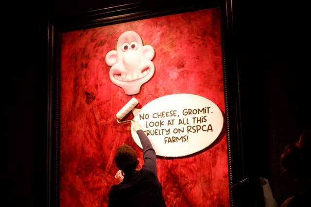 <h2><p>Animal Rising campaigners plastered Wallace and Gromit-themed posters onto the new painting</p></h2><p>
</p>