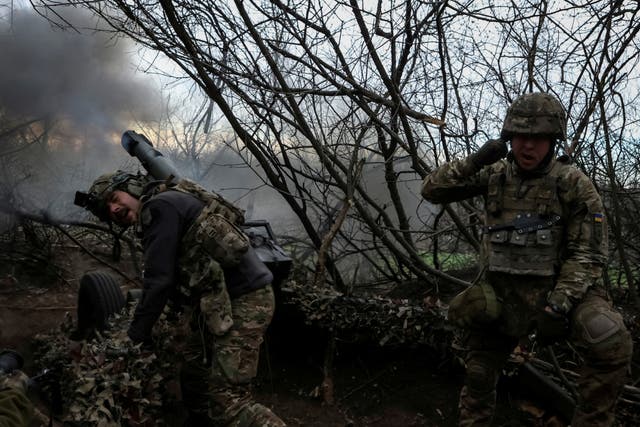 <p>Servicemen of the 12th Special Forces Brigade Azov of the National Guard of Ukraine fire a howitzer towards Russian troops, amid Russia’s attack on Ukraine, in Donetsk region</p>