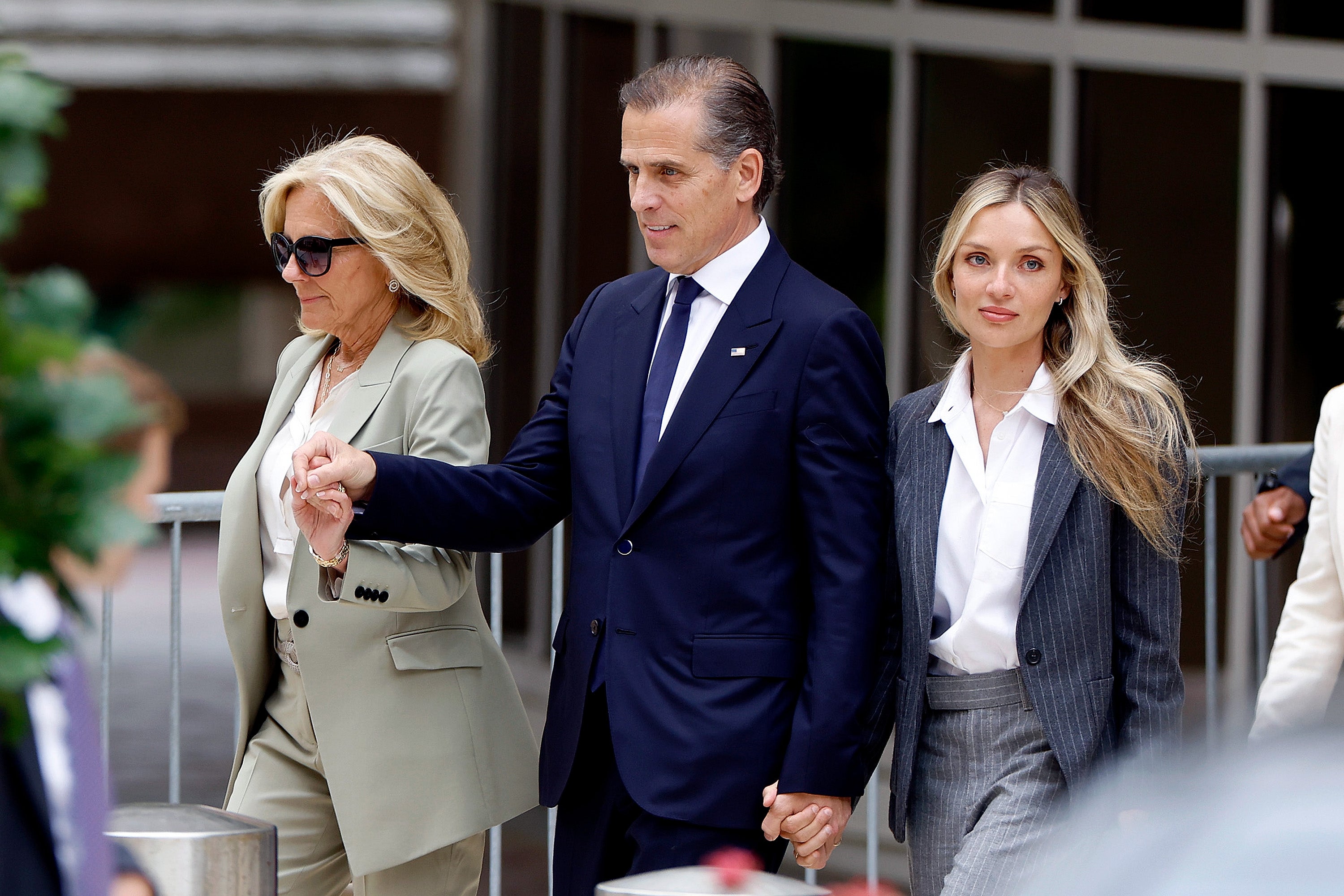 First Lady Jill Biden, Hunter Biden, and his wife Melissa Cohen Biden, leave the courthouse hand in hand on June 11, 2024 in Wilmington, Delaware after the guilty verdict was read