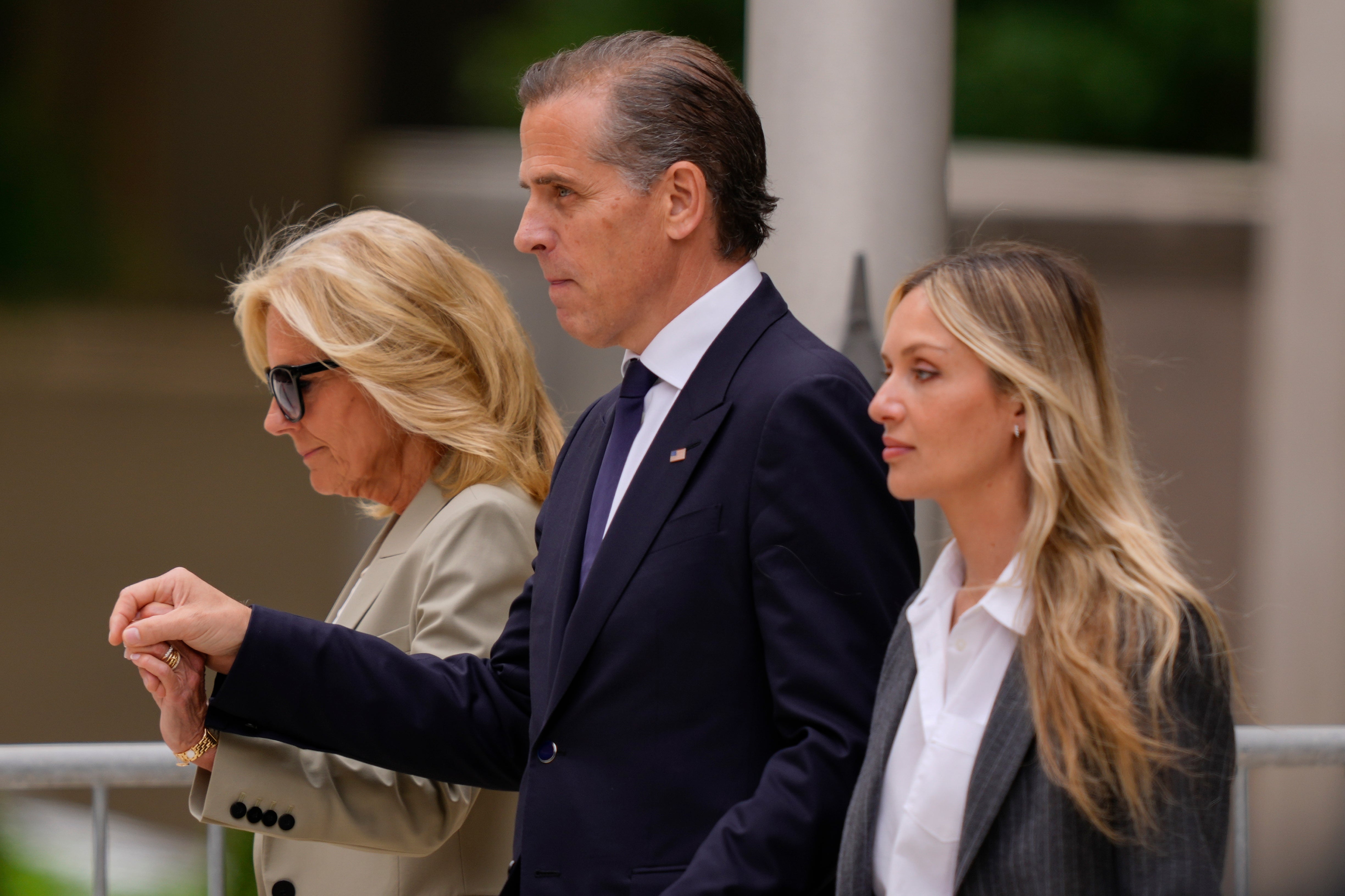 Hunter Biden, center, President Joe Biden's son, accompanied by his mother, first lady Jill Biden, left, and his wife, Melissa Cohen Biden, right, walking out of federal court after hearing the verdict, Tuesday, June 11, 2024, in Wilmington