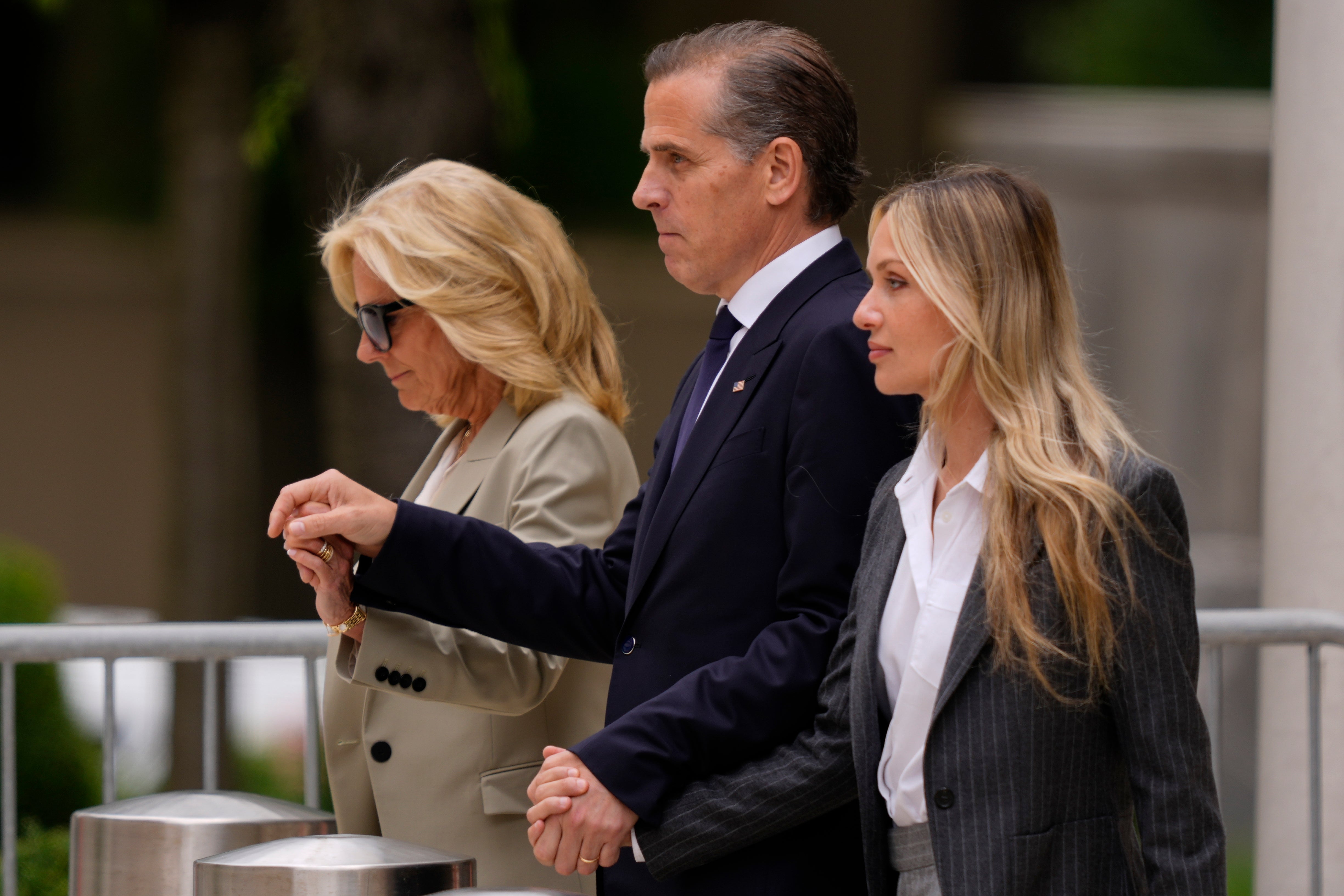 Hunter Biden, center, son of President Joe Biden, accompanied by his mother, first lady Jill Biden, left, and his wife, Melissa Cohen Biden, right, leave a federal court after hearing the verdict, Tuesday, June 11, 2024, in Wilmington, Del.