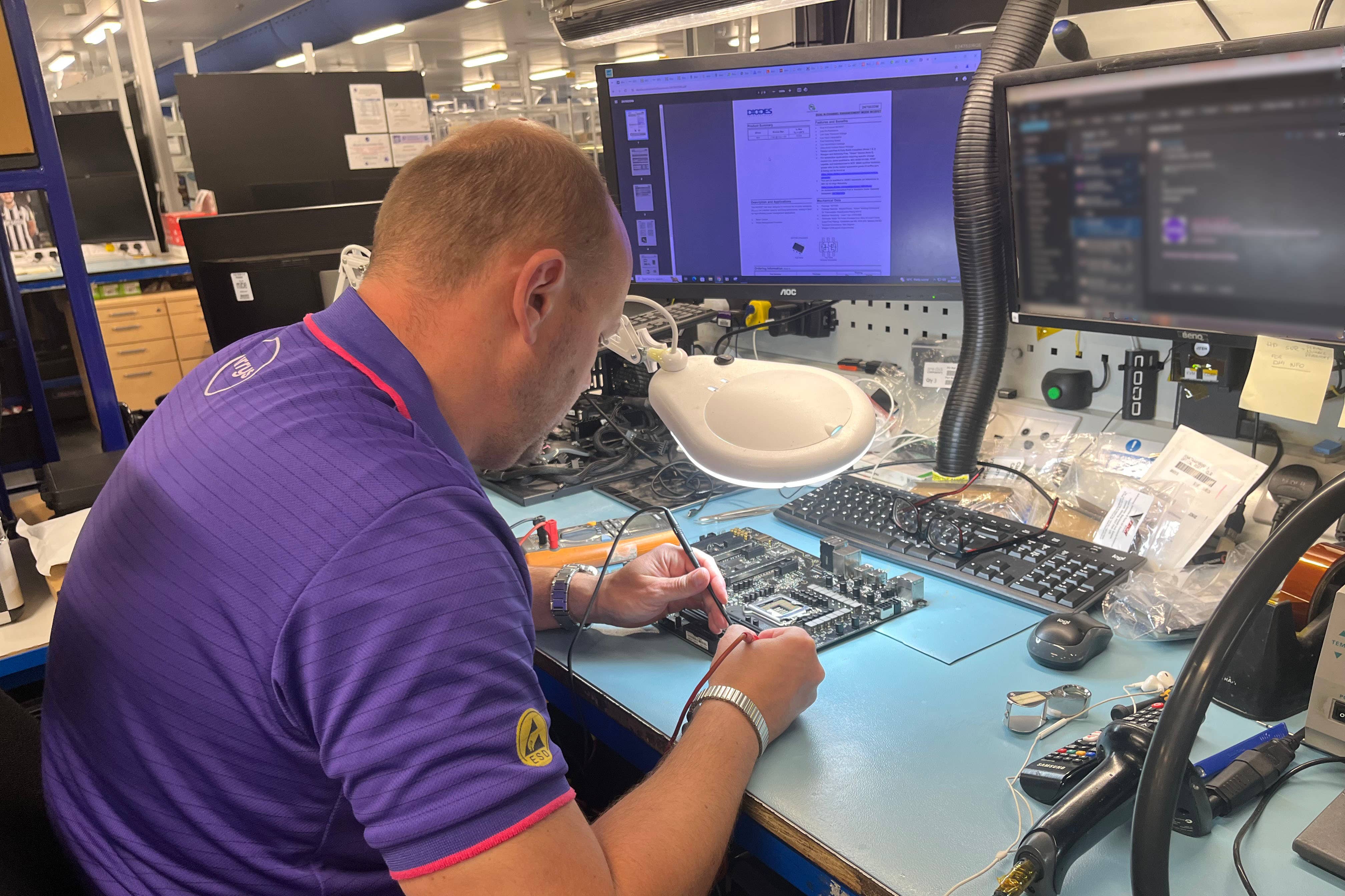 A technician working at Currys’ Repair Centre in Newark, Nottinghamshire (Rebecca Speare-Cole/PA)