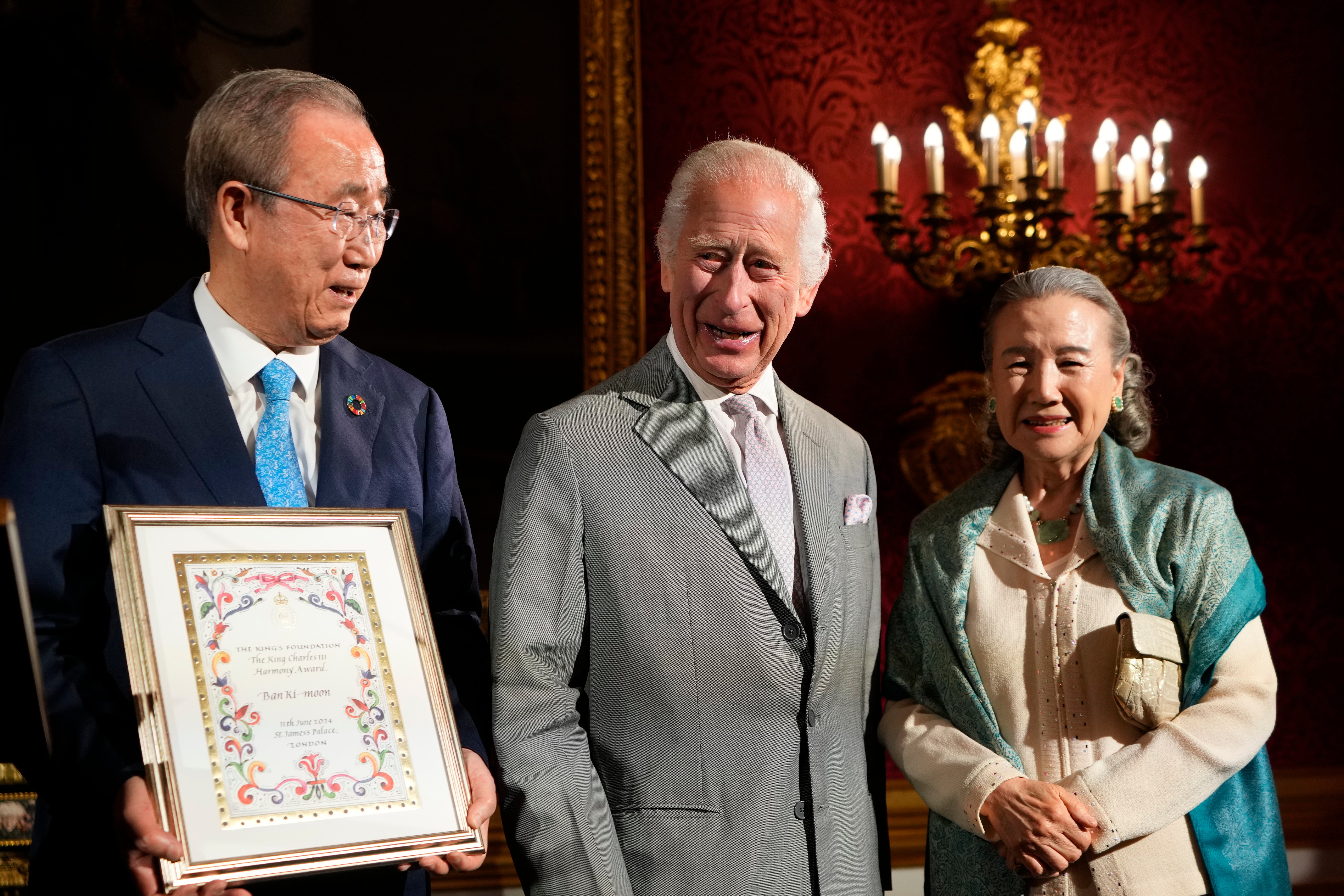 King Charles III (centre) presents the Harmony Award to Ban Ki-moon (left), the former United Nations Secretary General, at the King's Foundation charity's inaugural awards at St James's Palace
