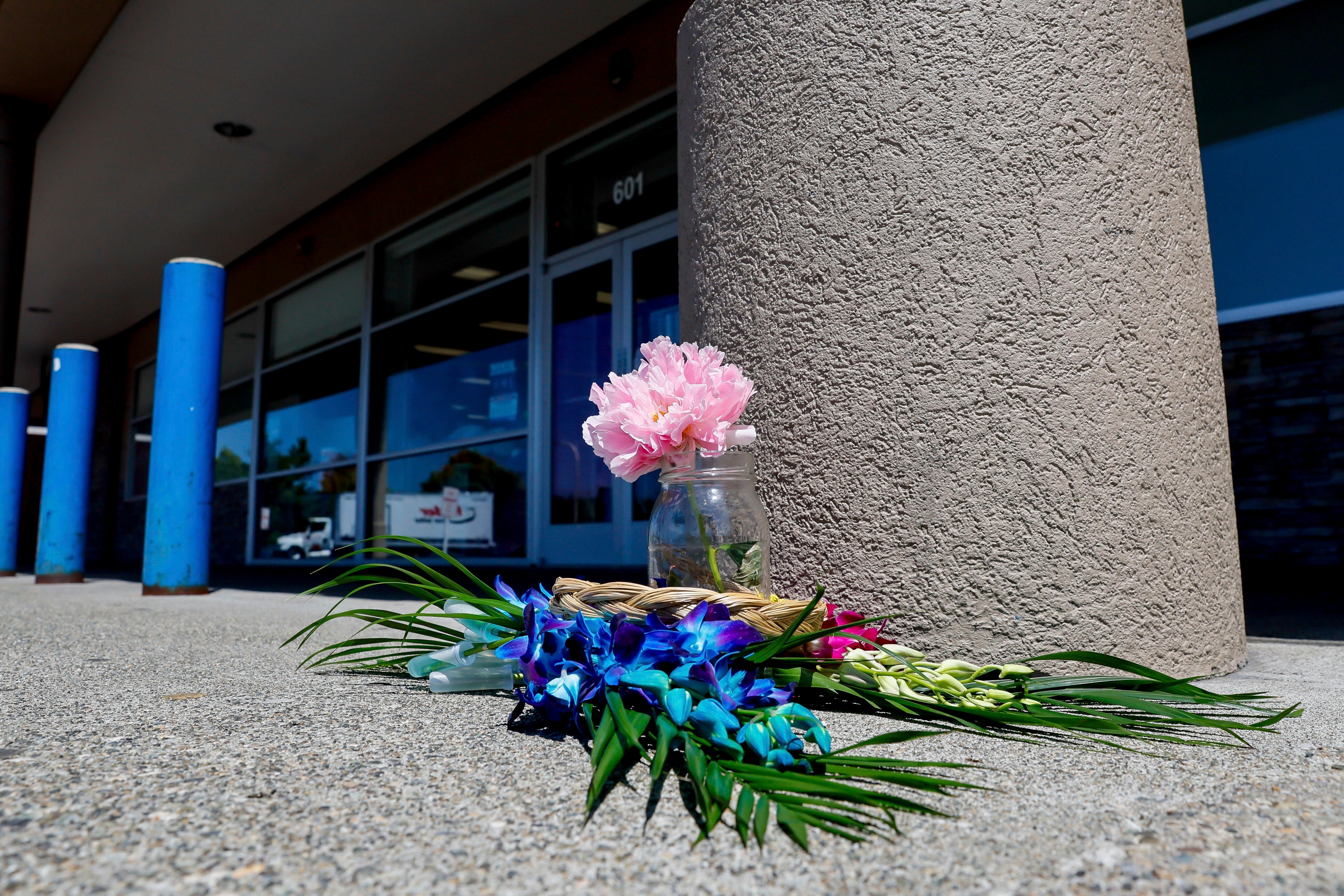 A small memorial is seen outside a Big 5 Sporting Goods store after 17-year-old Hazrat Ali Rohani was shot and killed