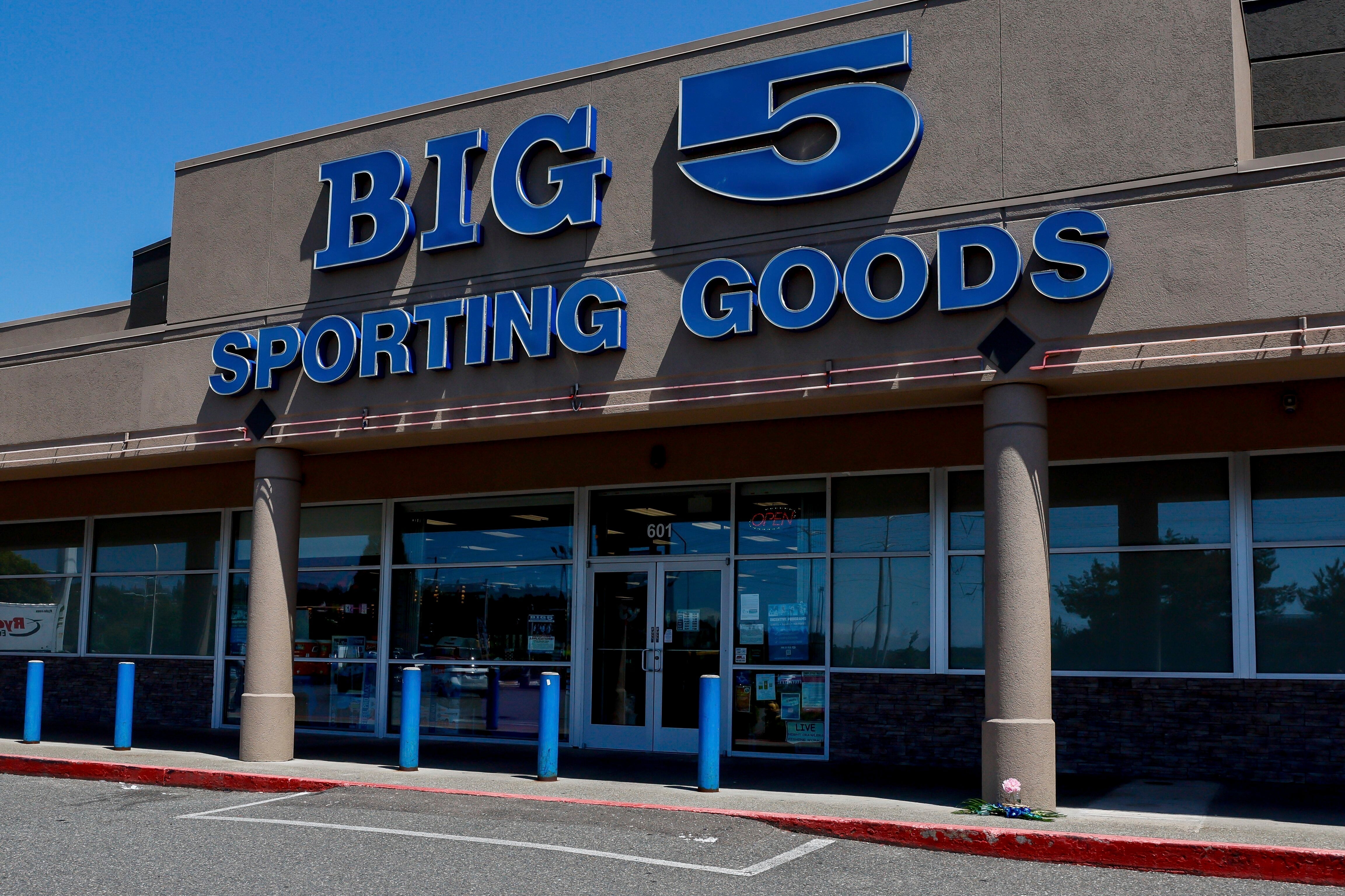 A small memorial is seen outside a Big 5 Sporting Goods store after 17-year-old Hazrat Ali Rohani was shot and killed on Wednesday June, 5, 2024, in Renton