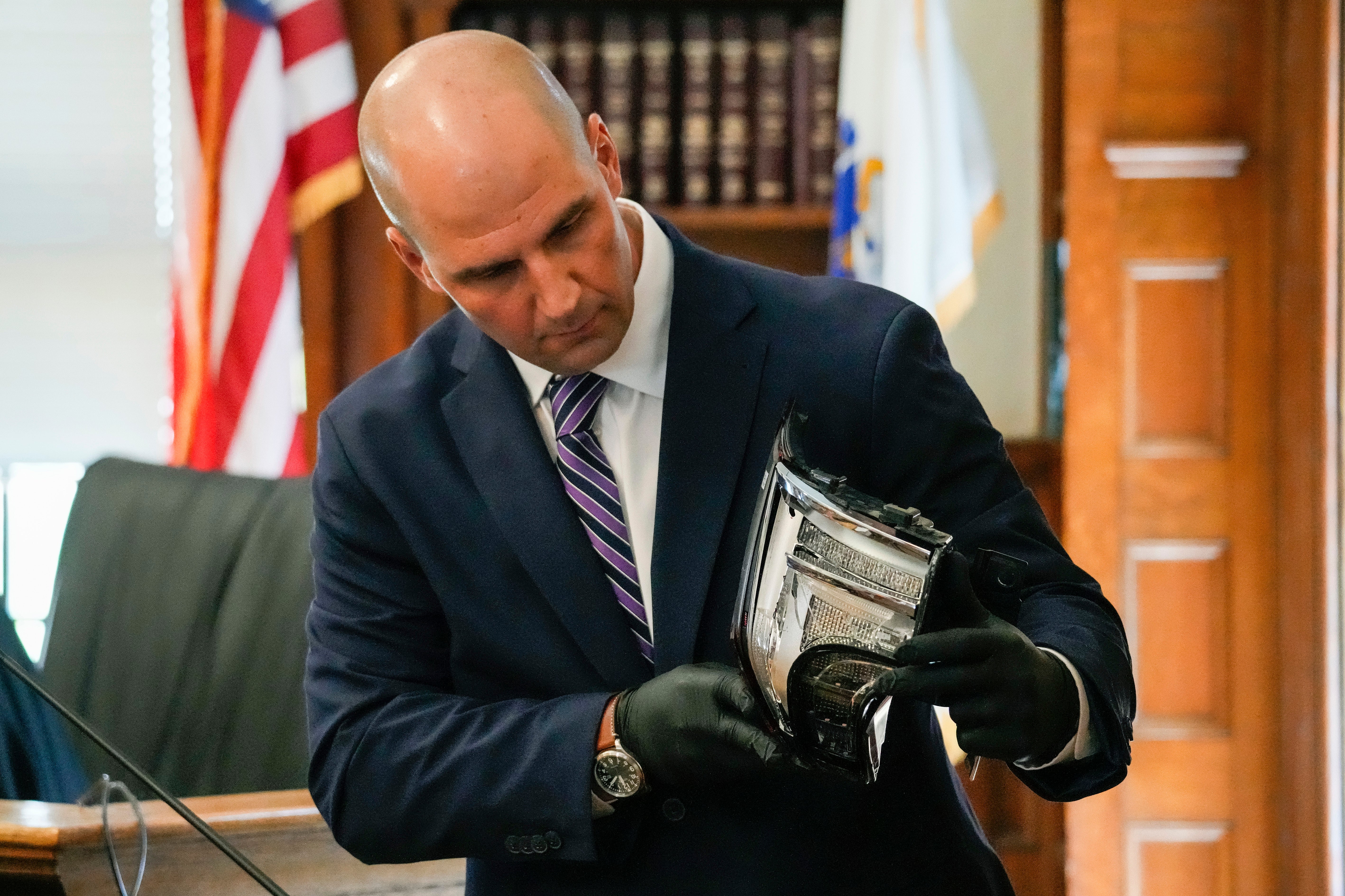 Massachusetts State Police Trooper Michael Proctor shows the jury a broken tail light while testifying in Read’s trial in June 2024