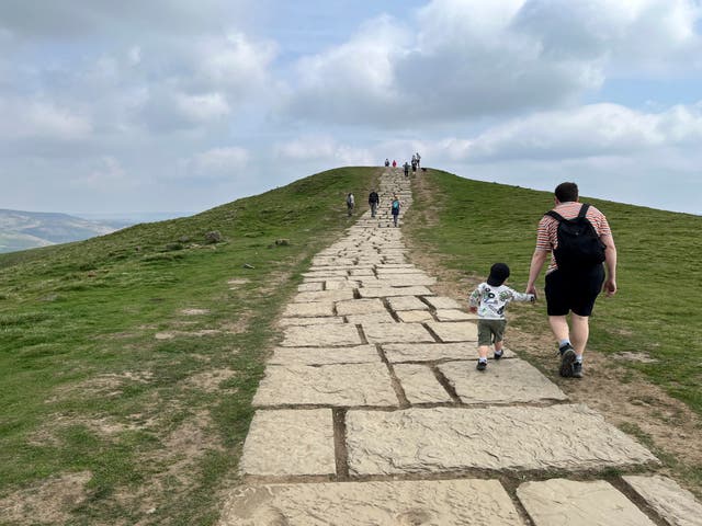 <p>Hikers make their way up Mam Tor</p>