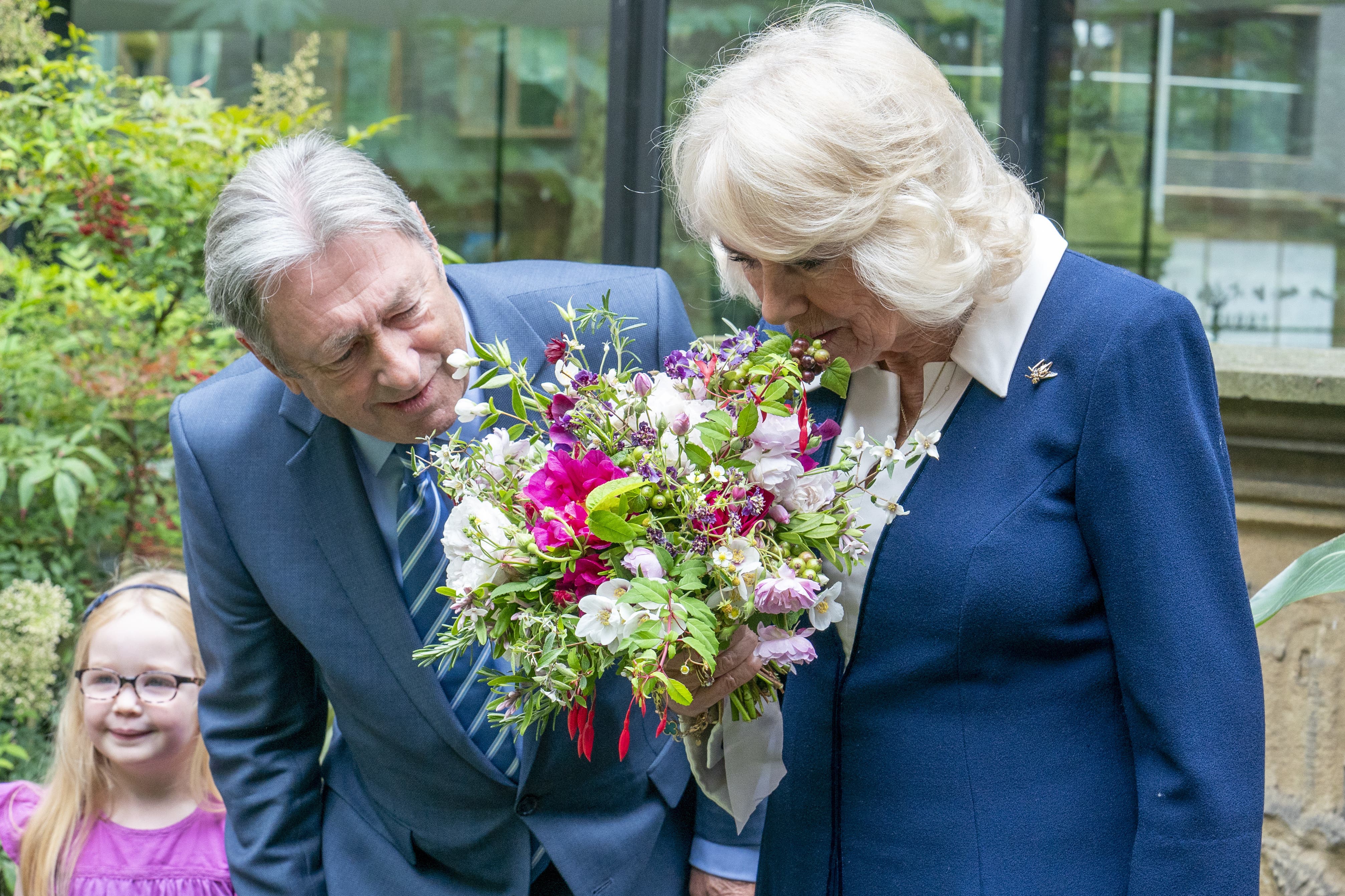 The Queen Camilla is welcomed by Alan Titchmarsh during a visit to the Gardening Bohemia exhibition at the Garden Museum, in Lambeth, south London (Arthur Edwards/The Sun/PA)